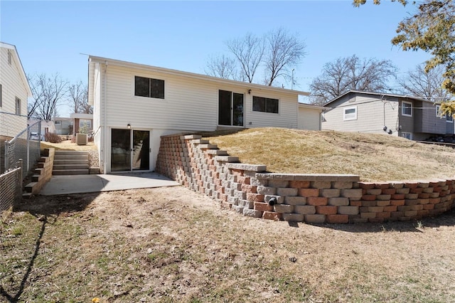 back of house featuring fence