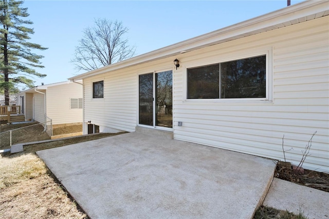 back of house featuring a patio area and fence