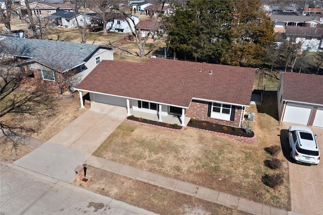 birds eye view of property with a residential view