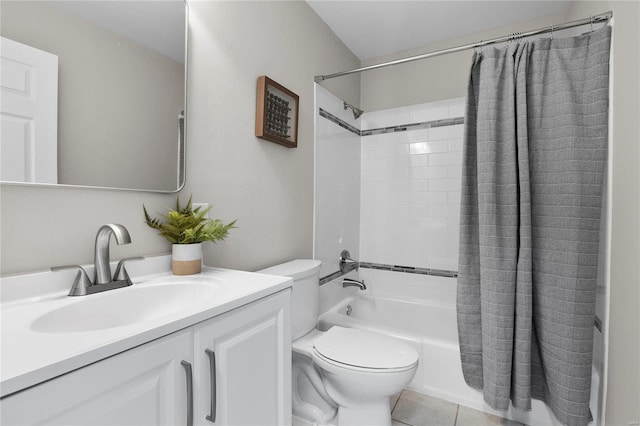 bathroom featuring tile patterned floors, shower / bath combo with shower curtain, toilet, and vanity