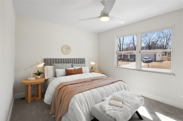 bedroom with carpet flooring, baseboards, and ceiling fan