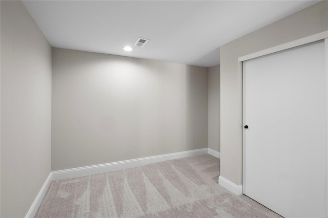 spare room with recessed lighting, visible vents, carpet floors, and baseboards