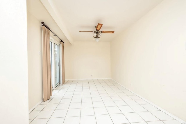 spare room with light tile patterned floors and a ceiling fan