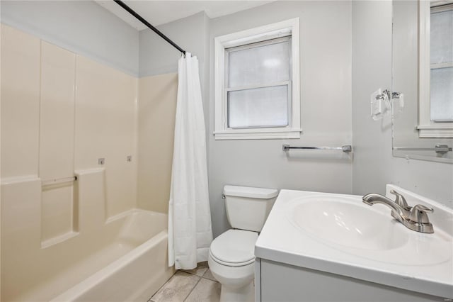 bathroom with shower / tub combo with curtain, vanity, toilet, and tile patterned floors