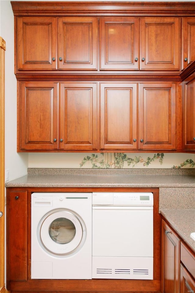 washroom featuring washer and dryer