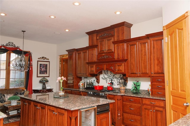 kitchen with wine cooler, recessed lighting, a kitchen island, and light stone countertops