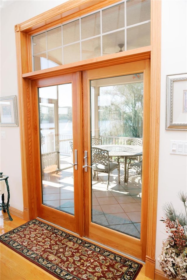 entryway with wood finished floors