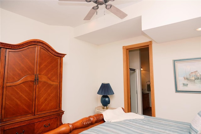 bedroom with ceiling fan and ensuite bath