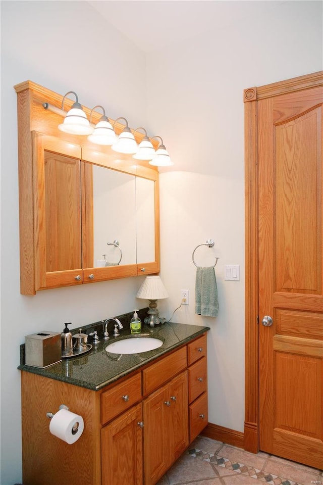 bathroom featuring vanity and baseboards