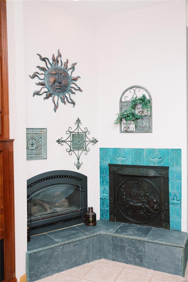 details with a tiled fireplace