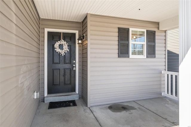 doorway to property with covered porch