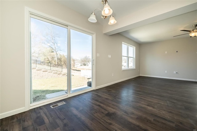 unfurnished room with dark wood-style flooring, visible vents, baseboards, and ceiling fan with notable chandelier