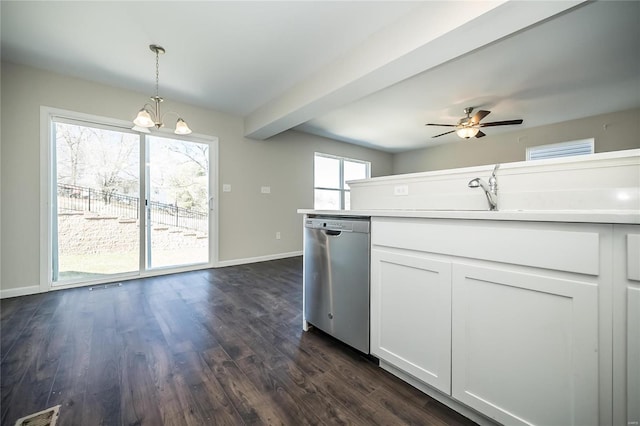 kitchen with dark wood finished floors, stainless steel dishwasher, a sink, and visible vents