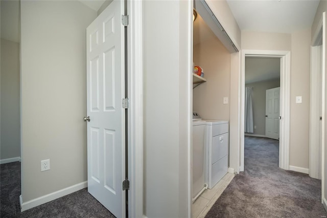 laundry room featuring laundry area, light colored carpet, baseboards, and separate washer and dryer