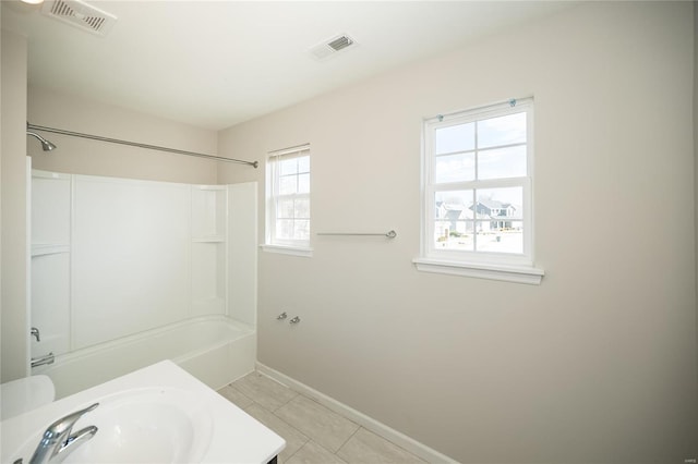 full bath with shower / washtub combination, visible vents, baseboards, and tile patterned floors