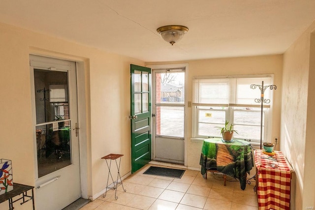 entryway with light tile patterned floors