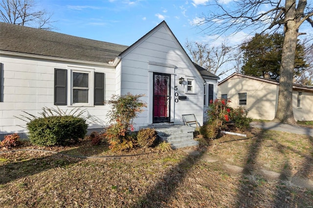 view of front of house featuring a shingled roof