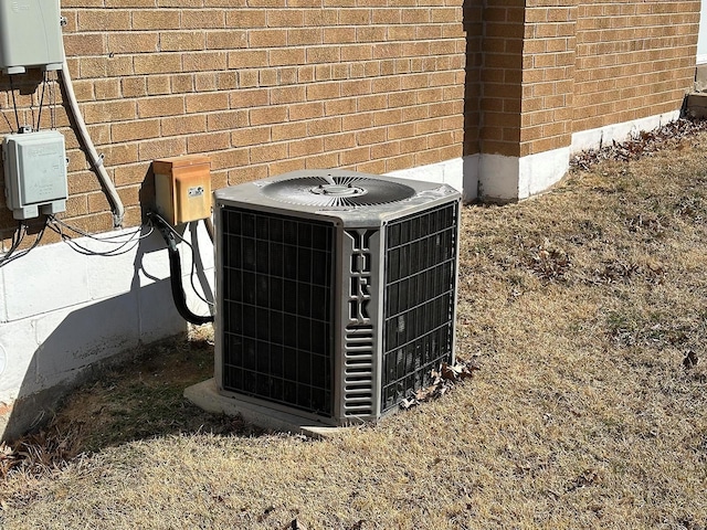 details with cooling unit and brick siding