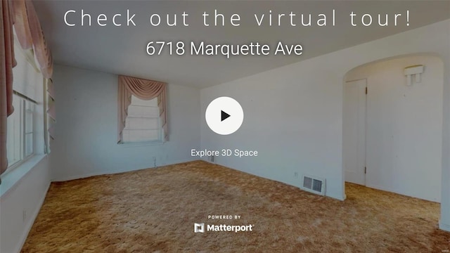 unfurnished room featuring visible vents and carpet floors