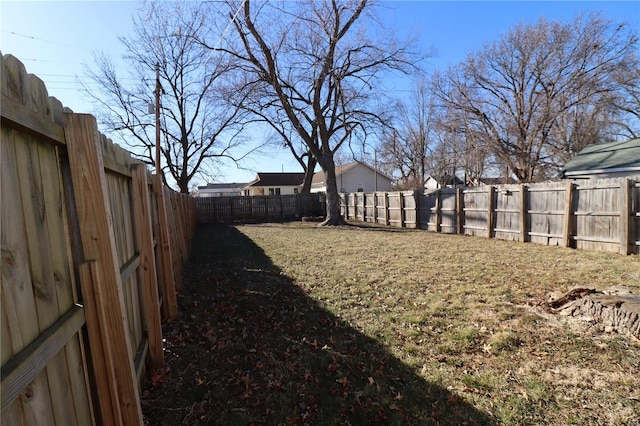 view of yard with a fenced backyard