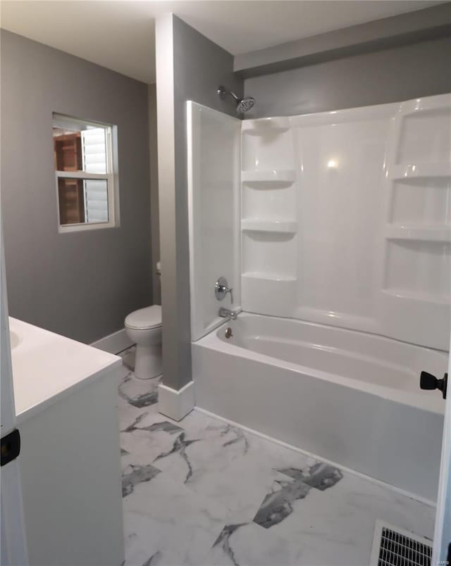 bathroom with marble finish floor, visible vents, toilet, vanity, and baseboards