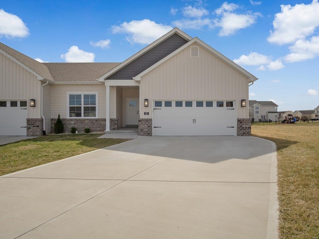 craftsman inspired home with a front yard, an attached garage, brick siding, concrete driveway, and board and batten siding