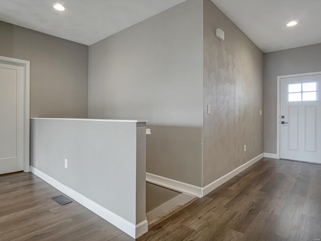 entrance foyer with recessed lighting, wood finished floors, and baseboards