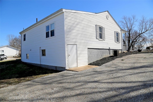 view of side of property with cooling unit