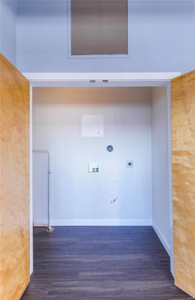 laundry area with hookup for a washing machine, hookup for an electric dryer, wood finished floors, laundry area, and baseboards