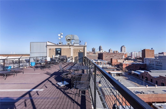 wooden deck with a city view