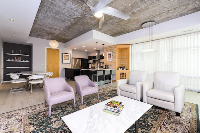 living room featuring ceiling fan and wood finished floors