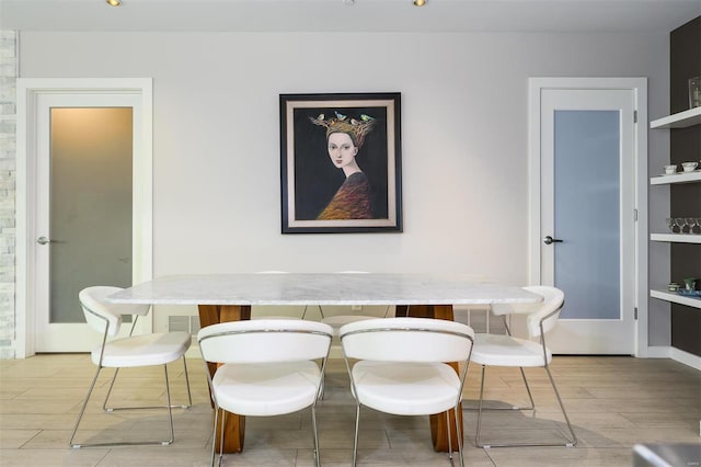 dining space featuring wood finish floors