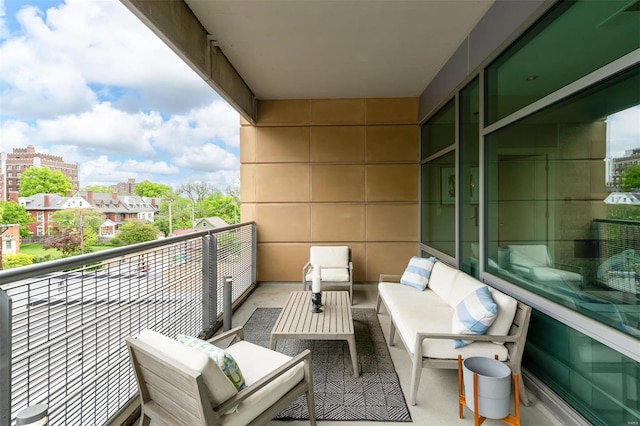 balcony featuring a view of city and outdoor lounge area