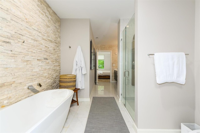 bathroom with a freestanding tub, a shower stall, marble finish floor, and connected bathroom