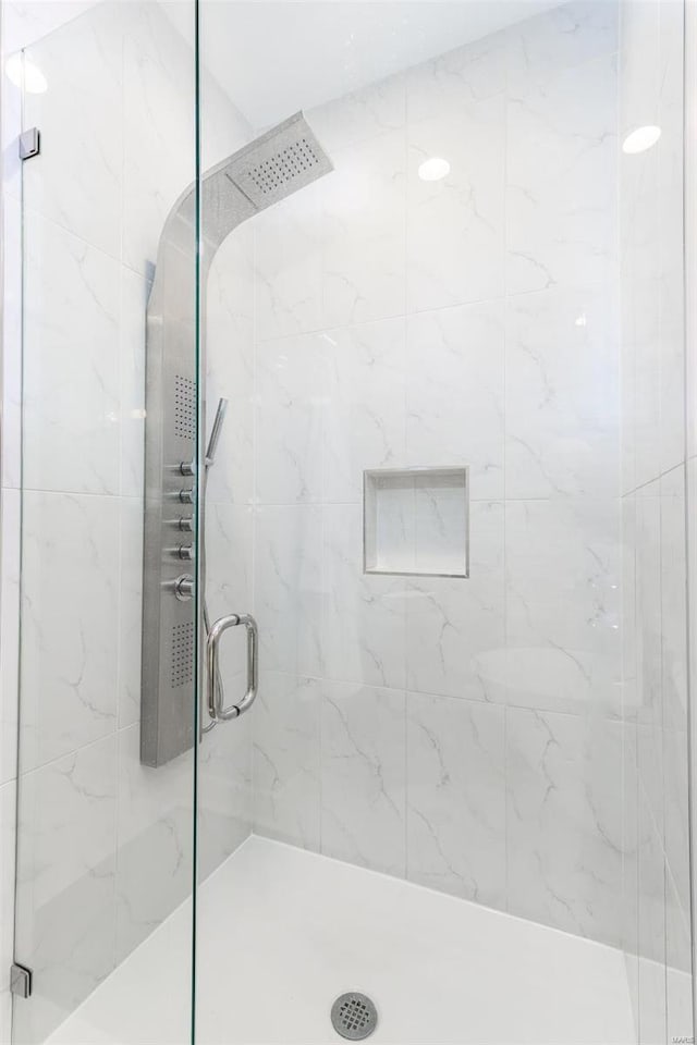 full bathroom featuring a shower stall