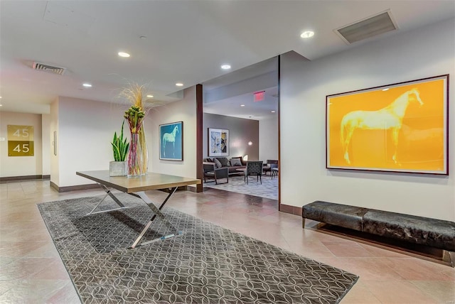 interior space with recessed lighting, visible vents, and baseboards