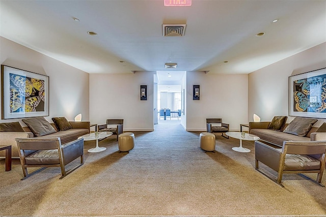 living room with carpet, visible vents, and baseboards