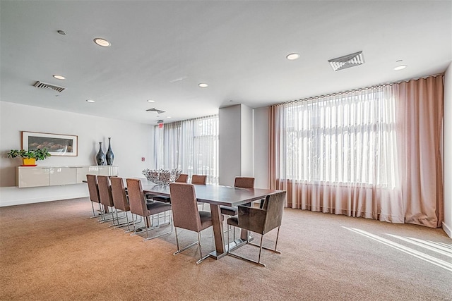 carpeted dining space featuring visible vents and recessed lighting