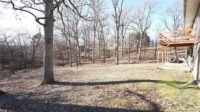 view of yard with a wooden deck