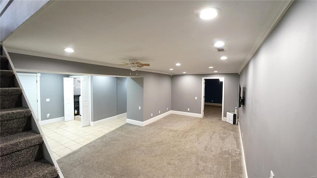 finished basement featuring recessed lighting, light carpet, visible vents, and stairs