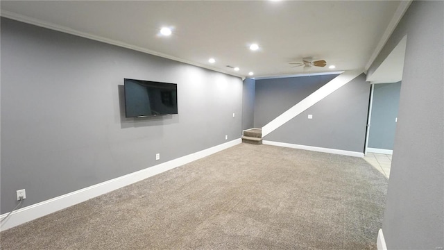 finished below grade area with baseboards, ceiling fan, ornamental molding, carpet, and recessed lighting