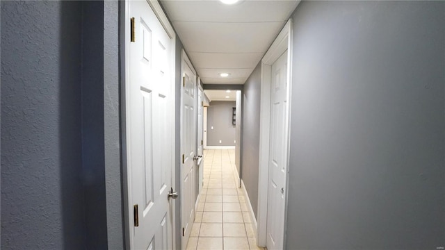 hallway featuring light tile patterned flooring