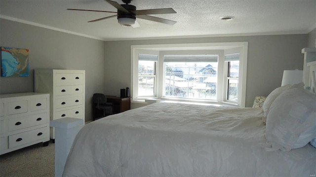 carpeted bedroom with a ceiling fan, visible vents, crown molding, and a textured ceiling