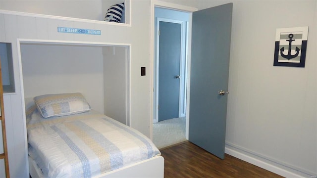 bedroom featuring dark wood finished floors