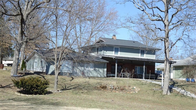 view of front of home featuring a chimney