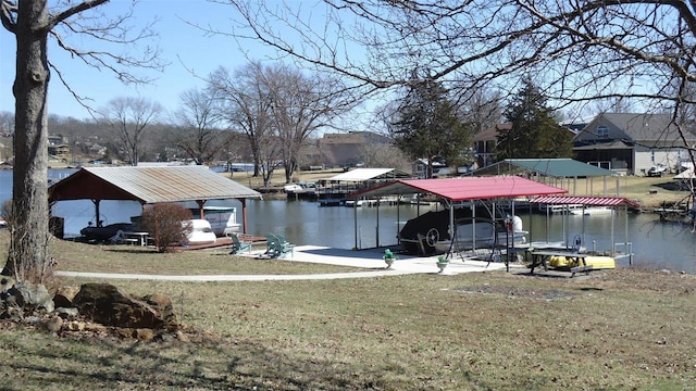 dock area with a yard, a water view, and boat lift