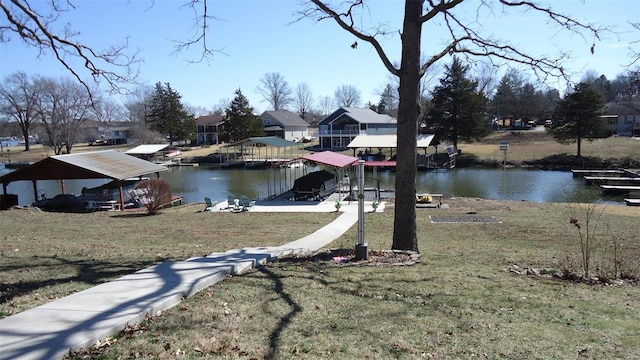 exterior space featuring a water view, boat lift, a residential view, and a dock