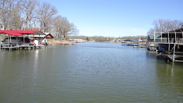 view of dock featuring a water view and boat lift