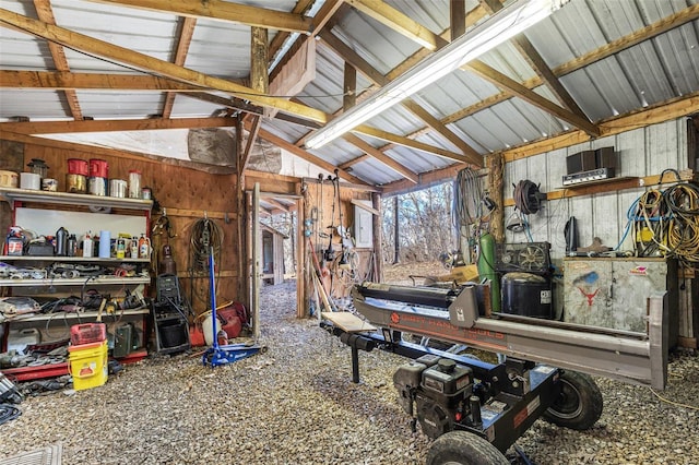 miscellaneous room with lofted ceiling and metal wall