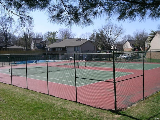 view of tennis court with fence